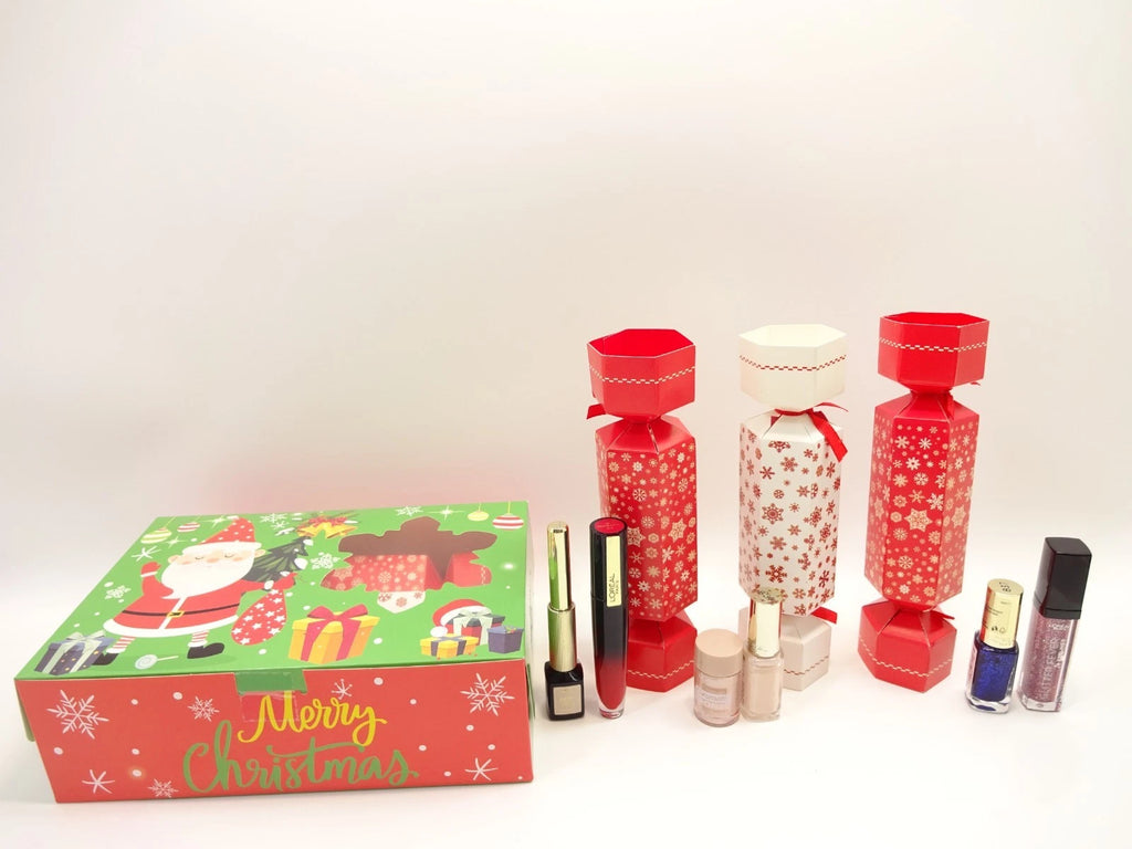 Festive L’Oreal beauty cracker set including nail polish, lip gloss, and lipstick