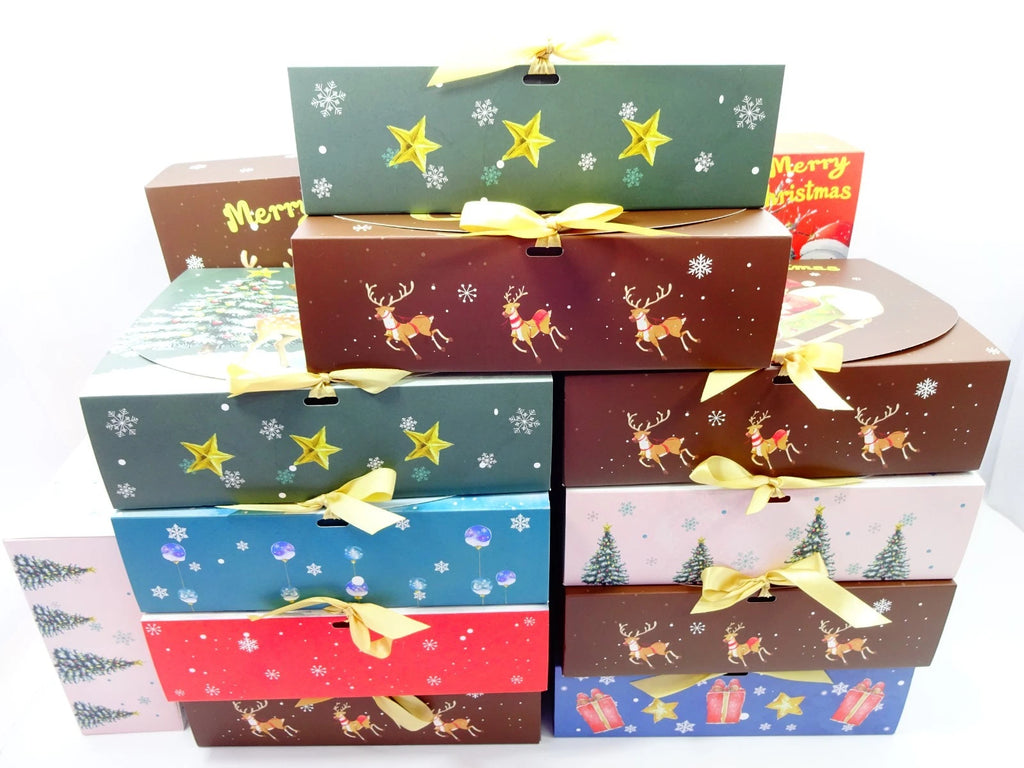 Stack of Christmas-themed gift boxes with various designs on a white background