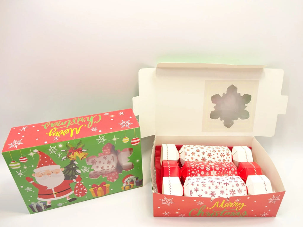 Santa-themed Christmas cracker box with three festive red and white beauty crackers