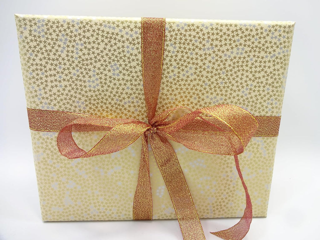 Gold luxury gift box beside the star-patterned Fathers Day gift set with copper ribbon
