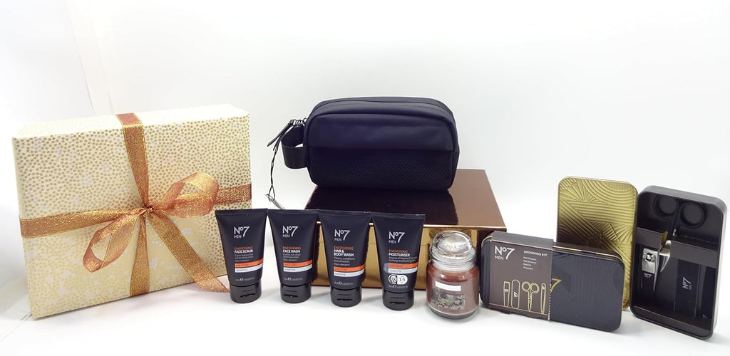 Full display of No7 skincare travel bag, face and body care, grooming kit, and candle in front of gold-wrapped gift box