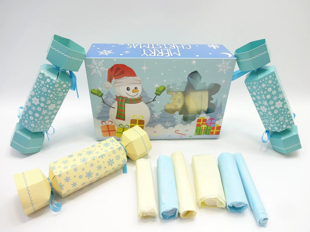 Open Maybelline cracker set showing pastel blue and cream crackers with tissue-wrapped contents