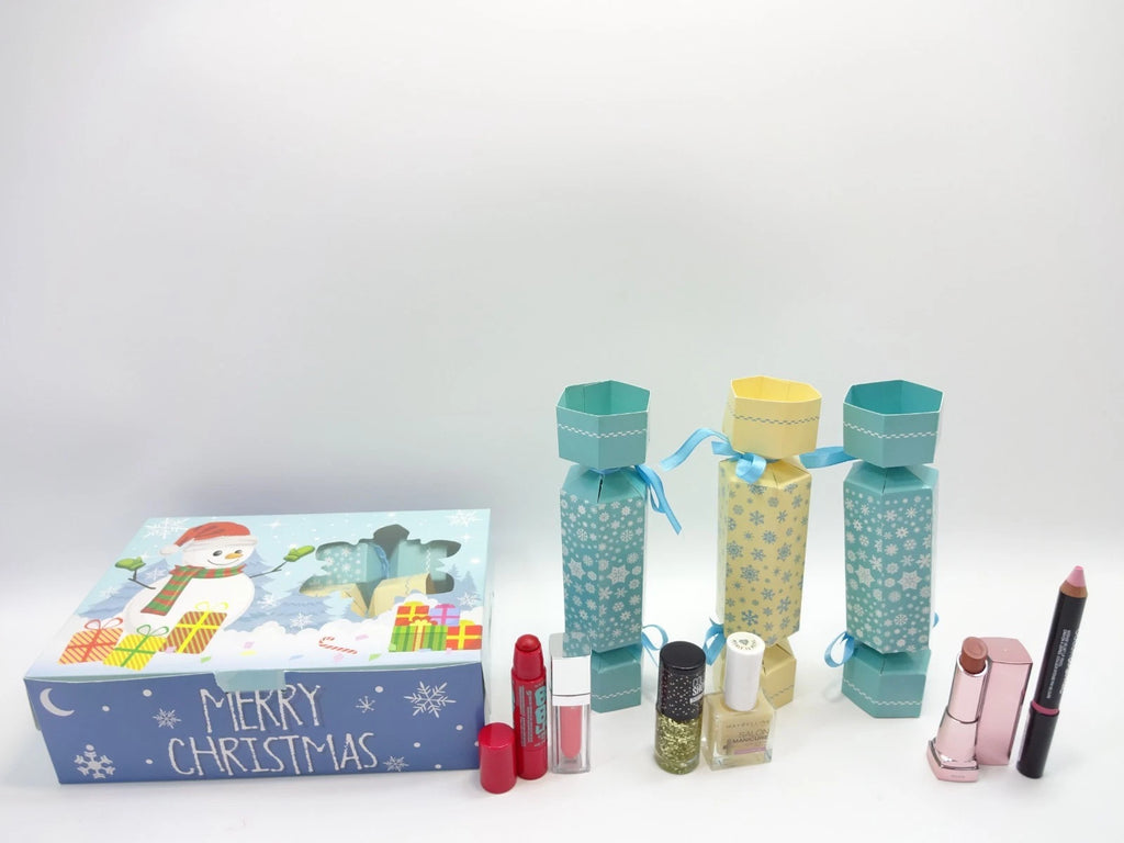 Maybelline makeup Christmas cracker collection including lipsticks, balms, and nail colours