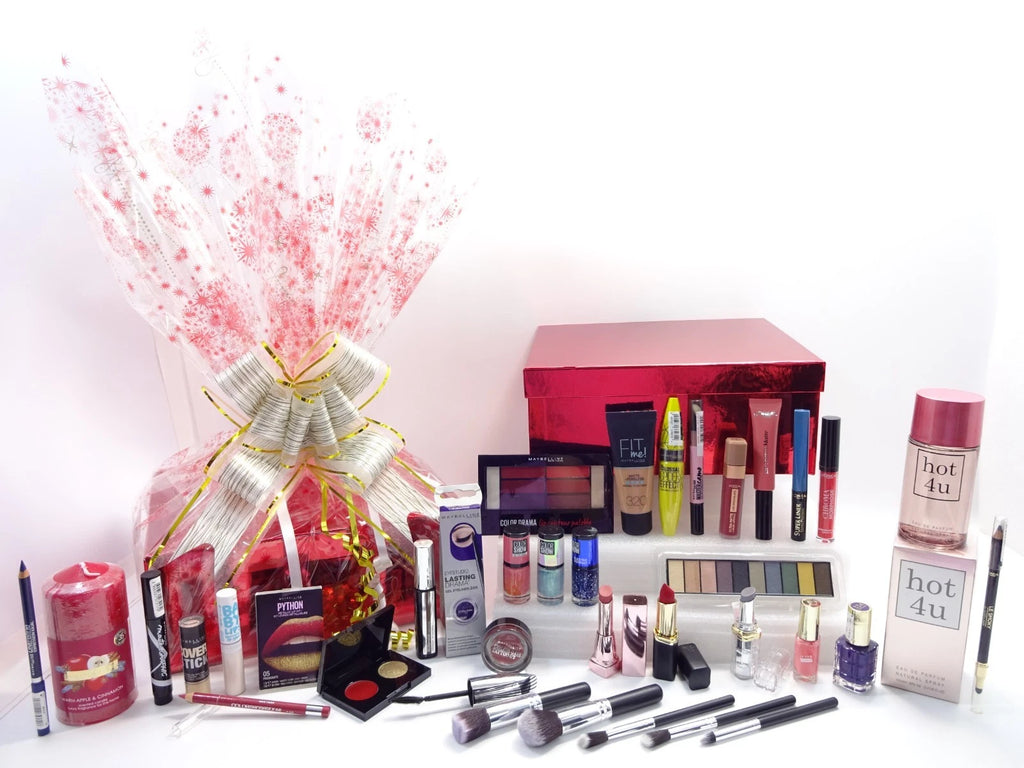 Assorted makeup products including lipsticks, nail polishes, and brushes on a white background.