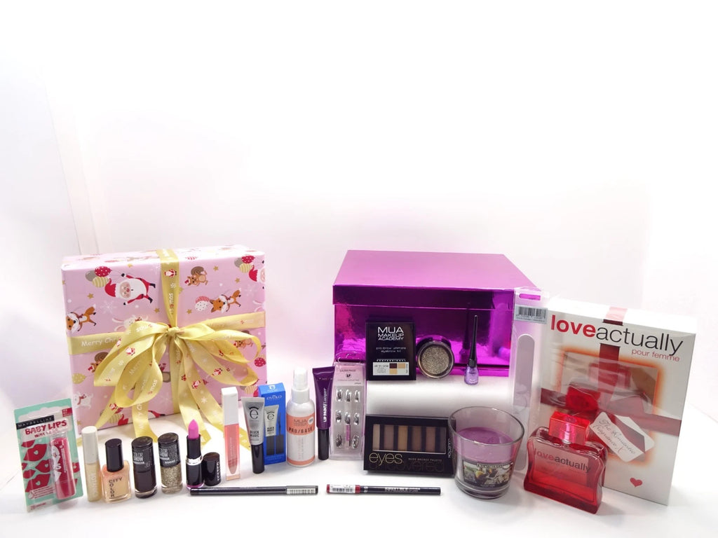 Collection of beauty products and a gift box on a white background