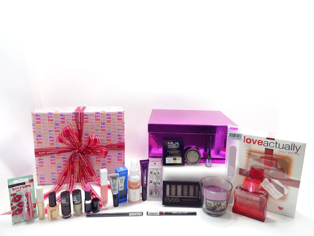Collection of beauty products and a gift box on a white background
