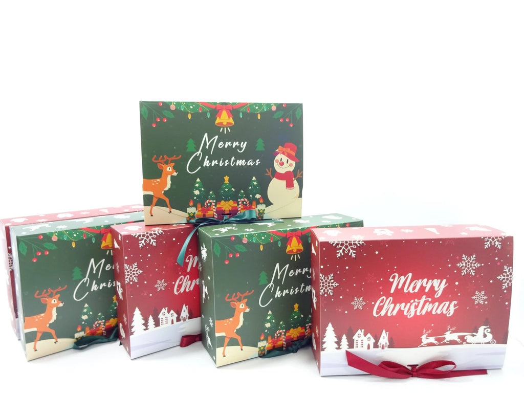 Set of Christmas-themed gift boxes with festive designs on a white background