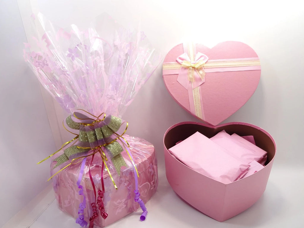Pink heart-shaped gift box with No7 and 17 skincare and makeup products inside