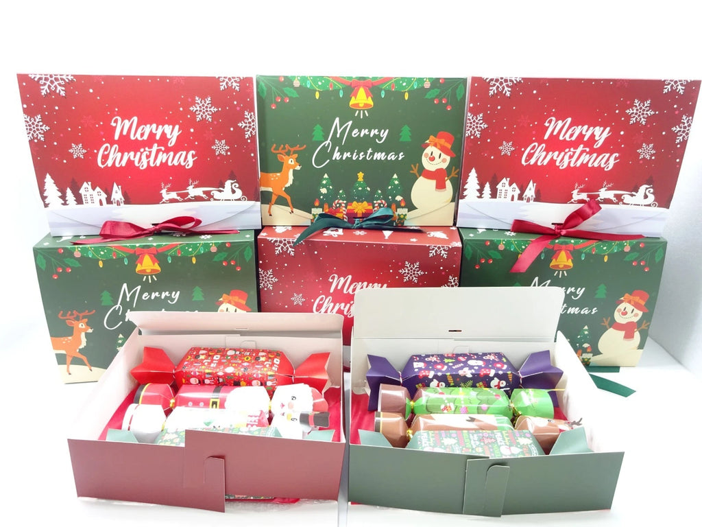Set of Christmas-themed gift boxes with festive designs and ribbons.