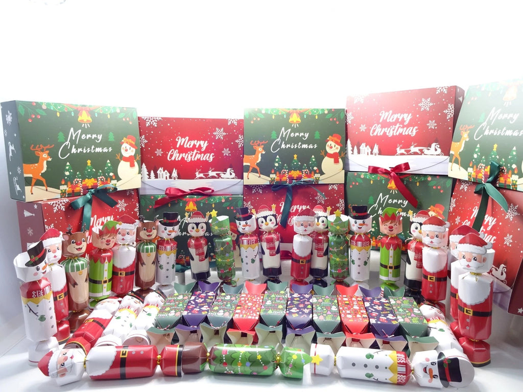 Collection of Christmas-themed gift boxes and crackers on a white background