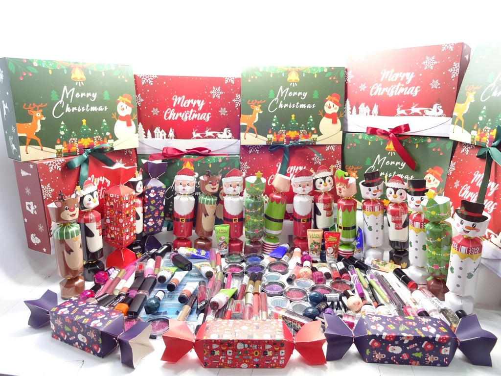 Collection of Christmas-themed makeup sets and accessories on a white background