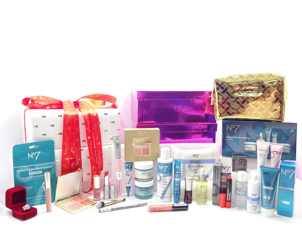 No7 Christmas blockbuster beauty collection featuring skincare and makeup products, gold cosmetic bag, and festive wrapped boxes.