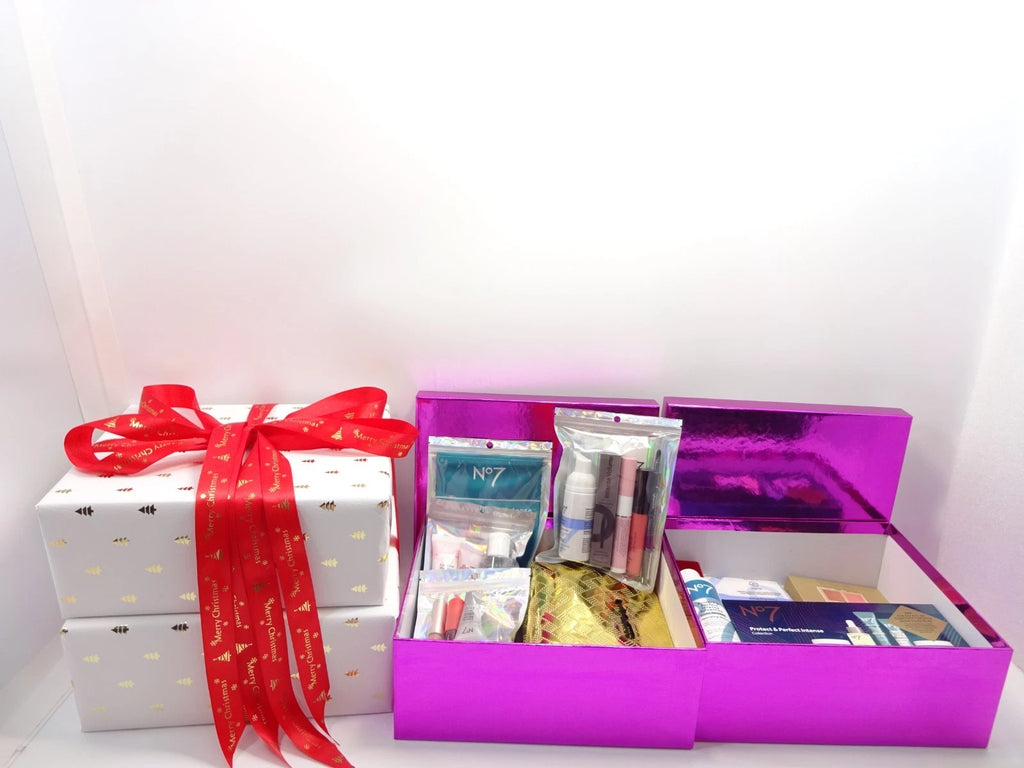 Open purple gift boxes displaying No7 skincare and makeup products, ready for holiday gifting.