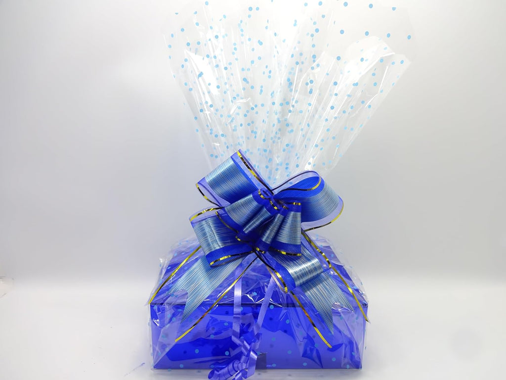 Beautifully wrapped Father’s Day hamper in shiny blue box with polka dot cellophane and a bold metallic blue ribbon bow