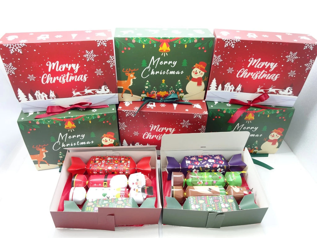 Open Christmas boxes with four colourful crackers containing mystery beauty gifts and makeup items