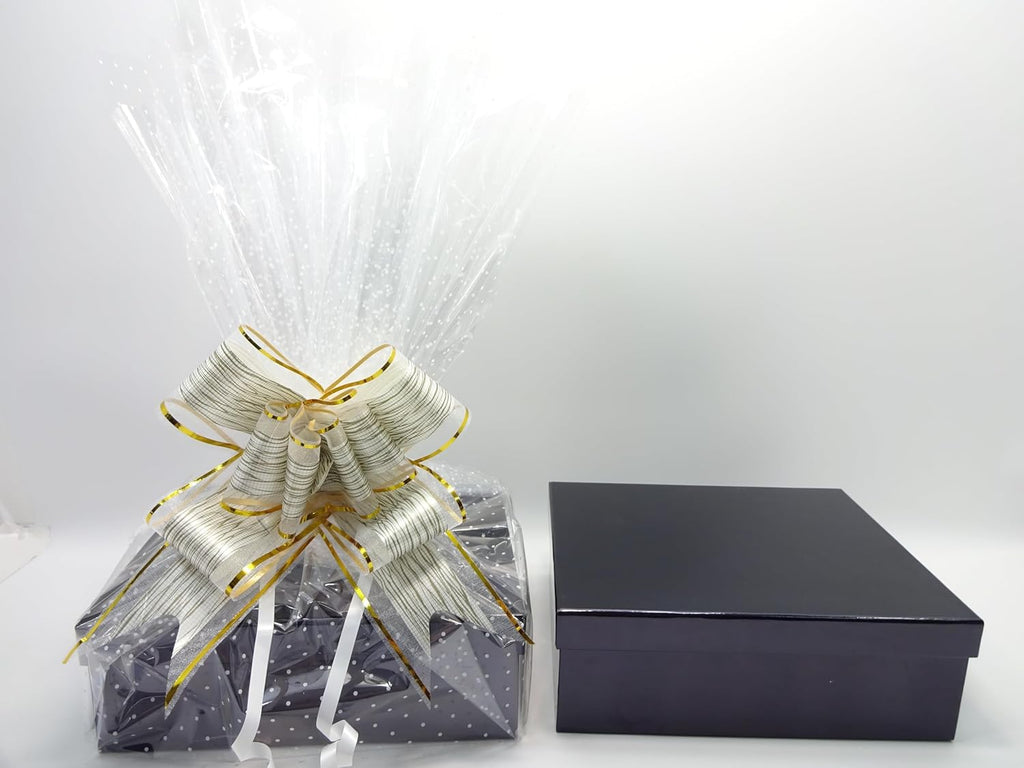 Front-facing view of Father's Day gift hamper with starry wrap and white ribbon, ideal for festive presentation