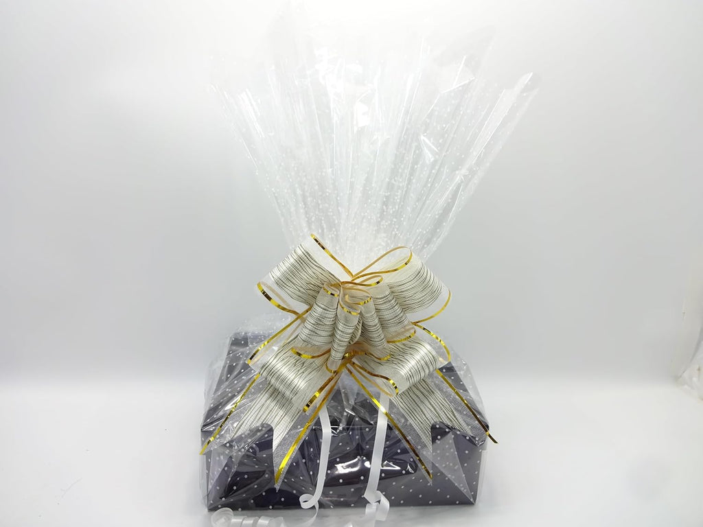 Luxury Father's Day gift hamper wrapped in black and gold star paper with elegant white organza ribbon and bow