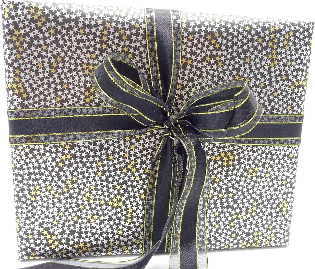 Starry-patterned gift-wrapped box with luxurious black and gold ribbon, elegant presentation