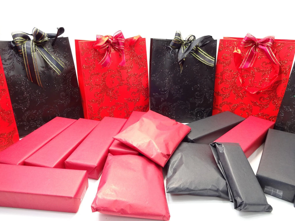 Assortment of L’Oreal and NYX makeup, nail polishes, jewellery pieces, and accessories displayed around Halloween mystery bags