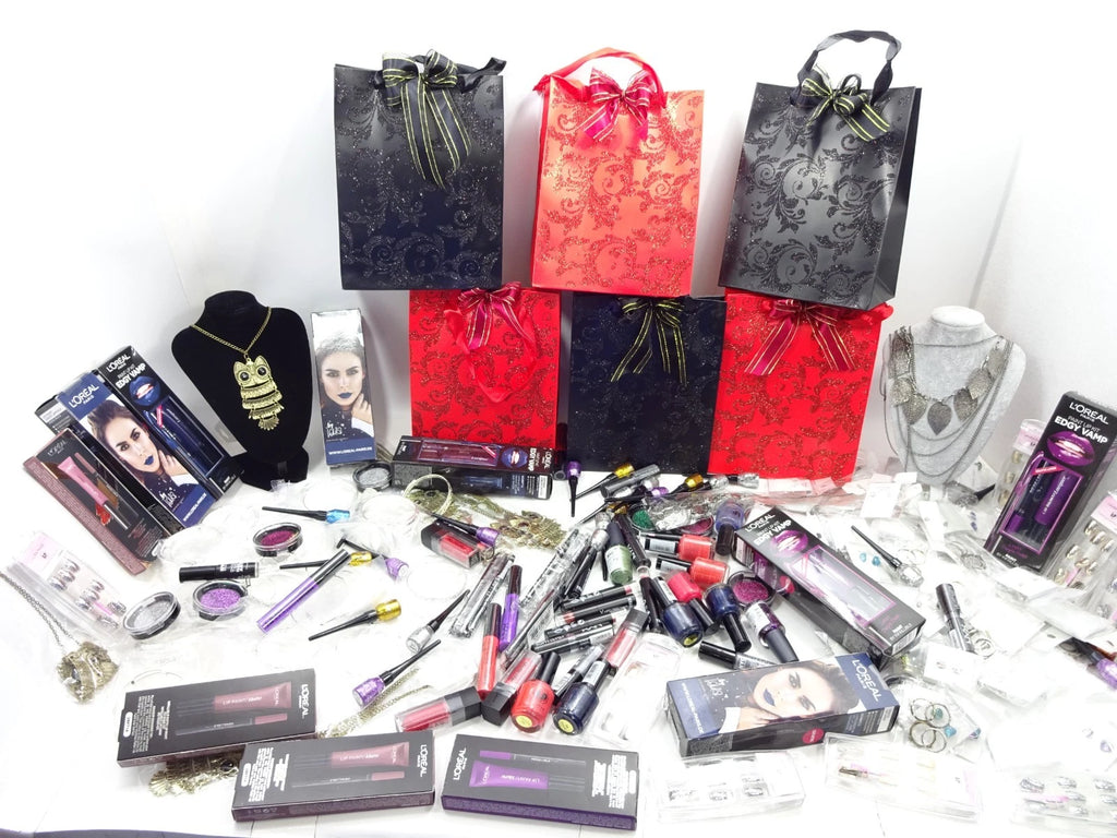 Elegant Halloween mystery gift bags in glossy black and red with glitter swirl patterns and matching ribbons