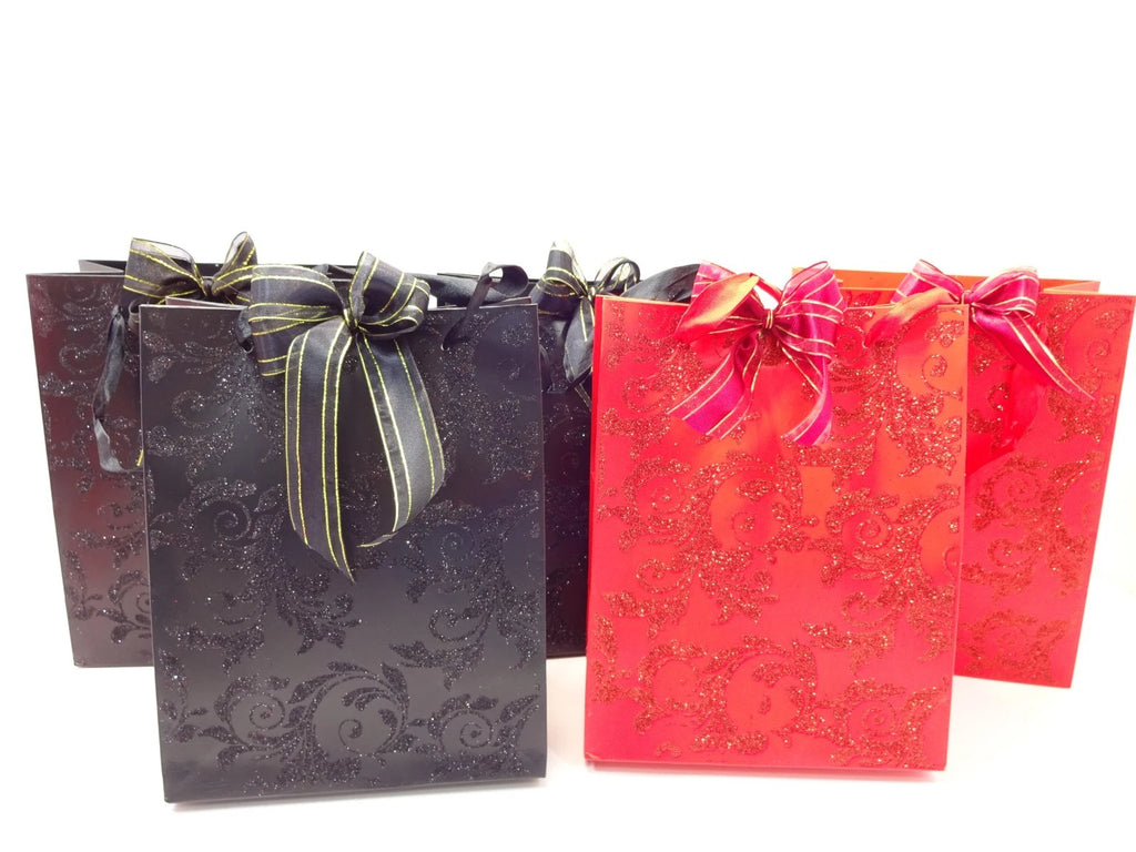 Front view of black and red glittery Halloween mystery bags tied with bows