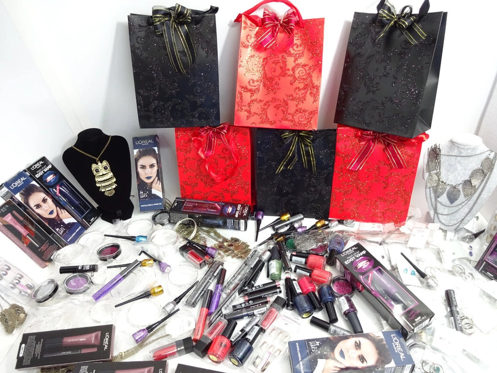 Halloween mystery gift bags with coordinated wrapped items in festive red and black tissue paper