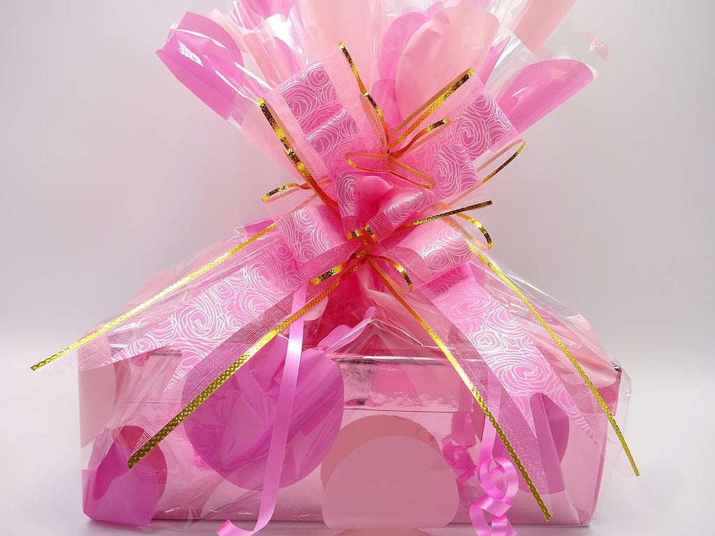 Jack Wills gift hamper with a selection of body care products and lip balms, gift-wrapped with a pink decorative ribbon.