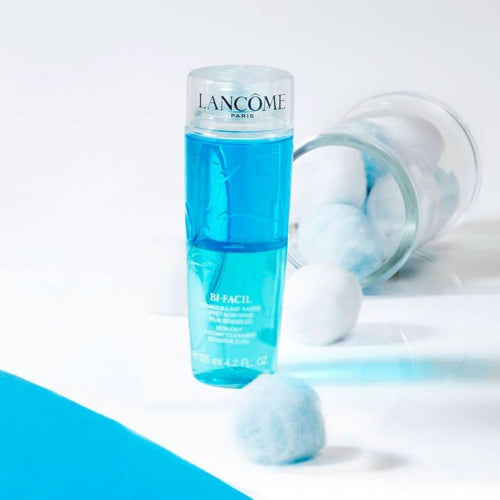 Lancôme Bi-Facil Eye Makeup Remover 125ml bottle displayed with cotton balls on a white background