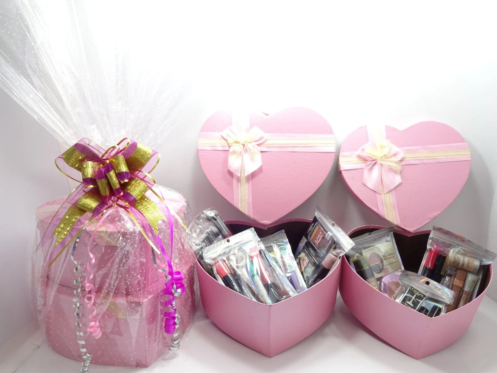 Open heart boxes filled with assorted L’Oréal cosmetics and makeup products ready for gifting