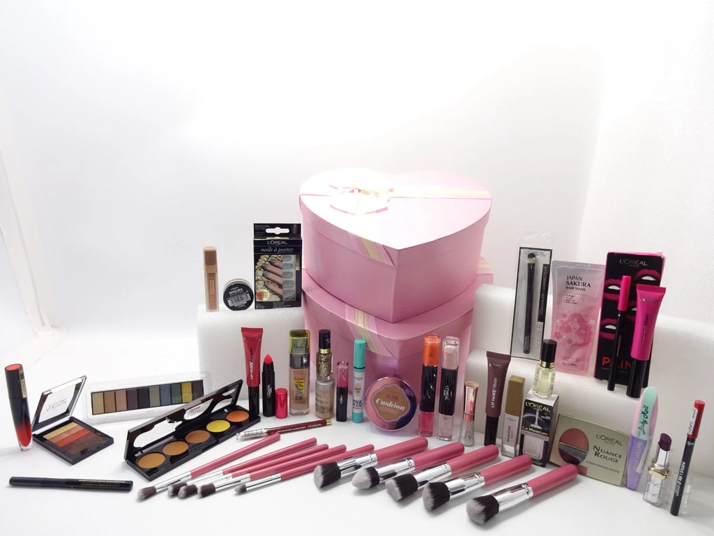 L’Oréal makeup beauty gift hamper with cosmetics, brushes, palettes, and pink heart boxes