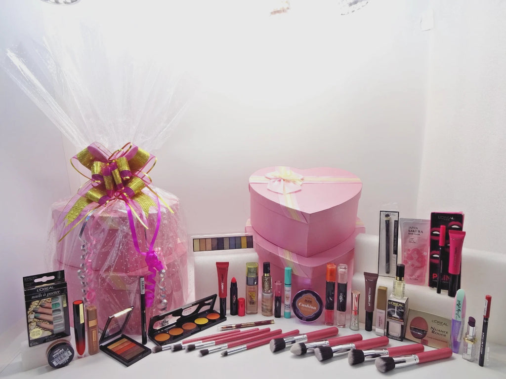 L’Oréal beauty gift set with brushes, lipsticks, eyeshadows, foundations, and heart gift boxes