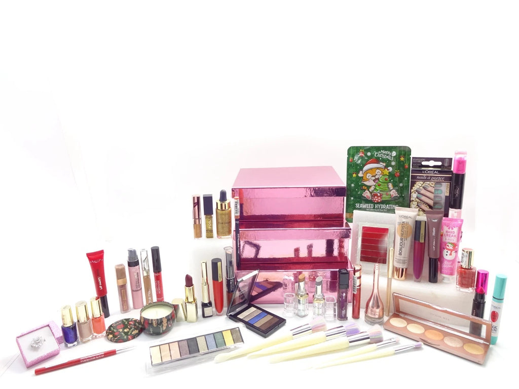 Display of all included beauty items — lipsticks, eyeshadows, perfumes, nail polishes, and crystal ring