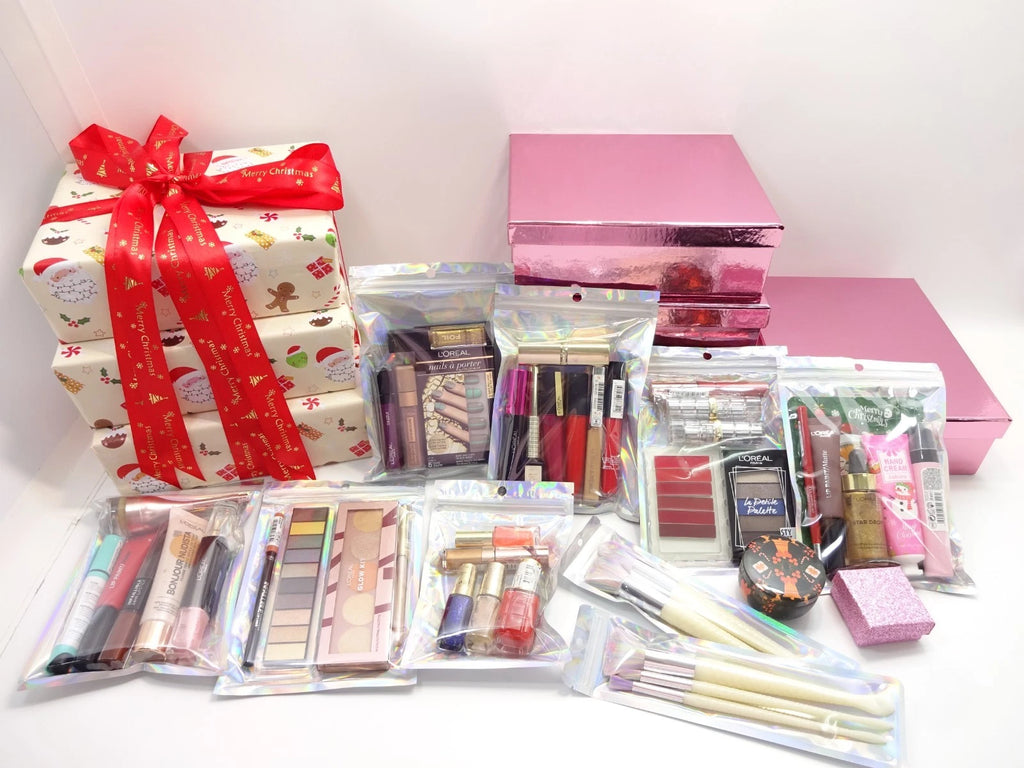 Full display of L'Oréal makeup, nail, skincare, brushes, and accessories in front of pink drawer boxes