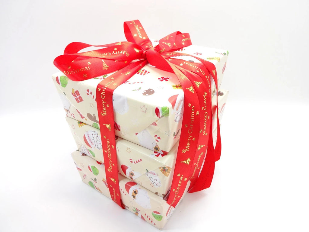 L'Oréal Premium Christmas Beauty Box gift set stacked with red ribbon and festive wrapping