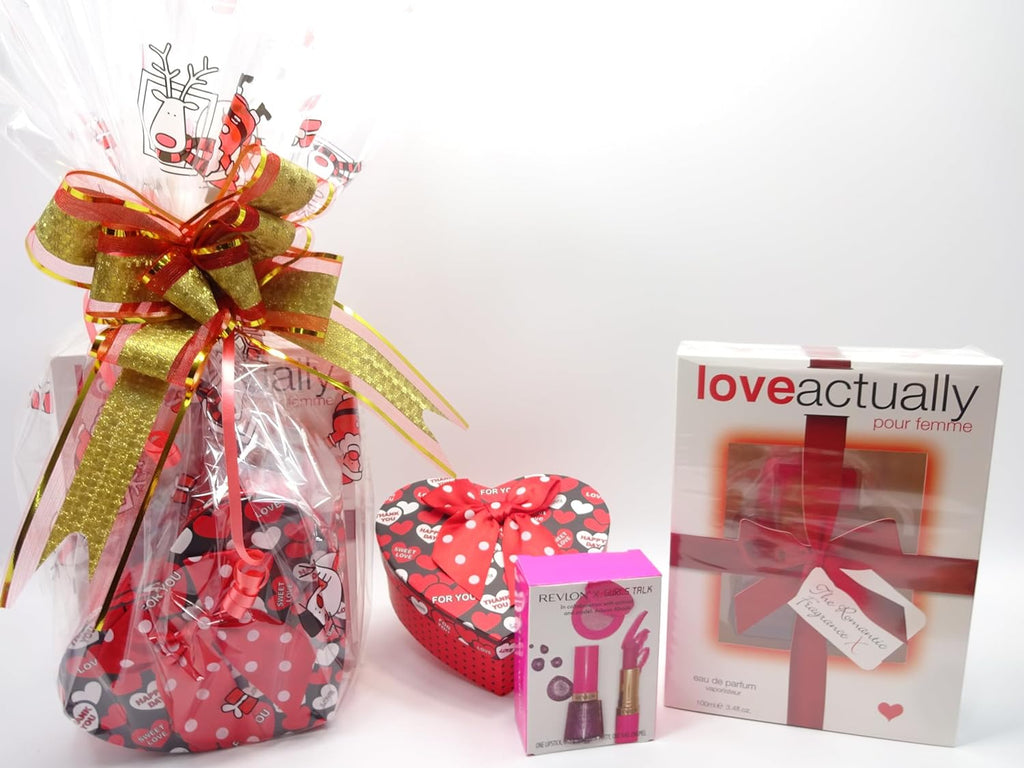 Love Actually perfume and makeup gift hamper set featuring 100ml perfume bottle and three makeup items presented with a red festive bow.