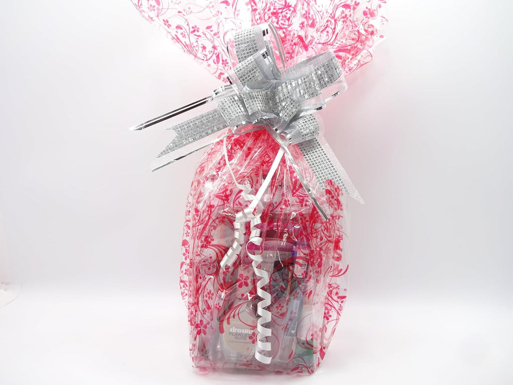 Love Actually Perfume and Makeup Hamper wrapped in silver and pink cellophane with silver bow