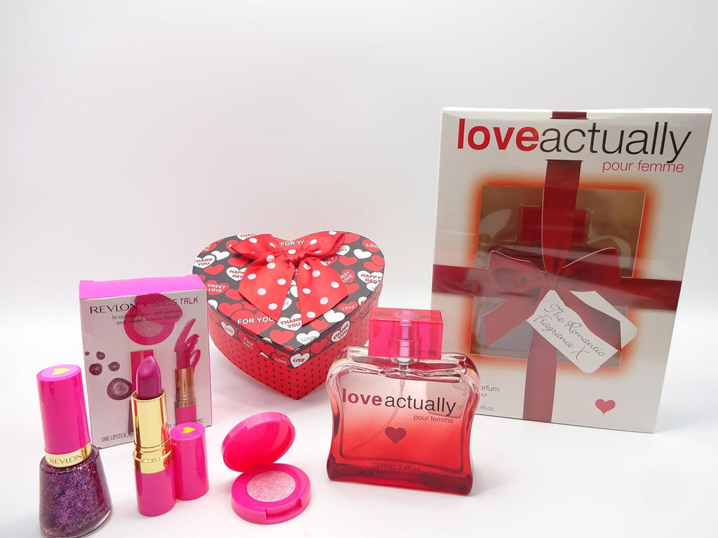 Unwrapped Love Actually 100ml perfume bottle alongside makeup products and heart-shaped gift box, perfect for any occasion.