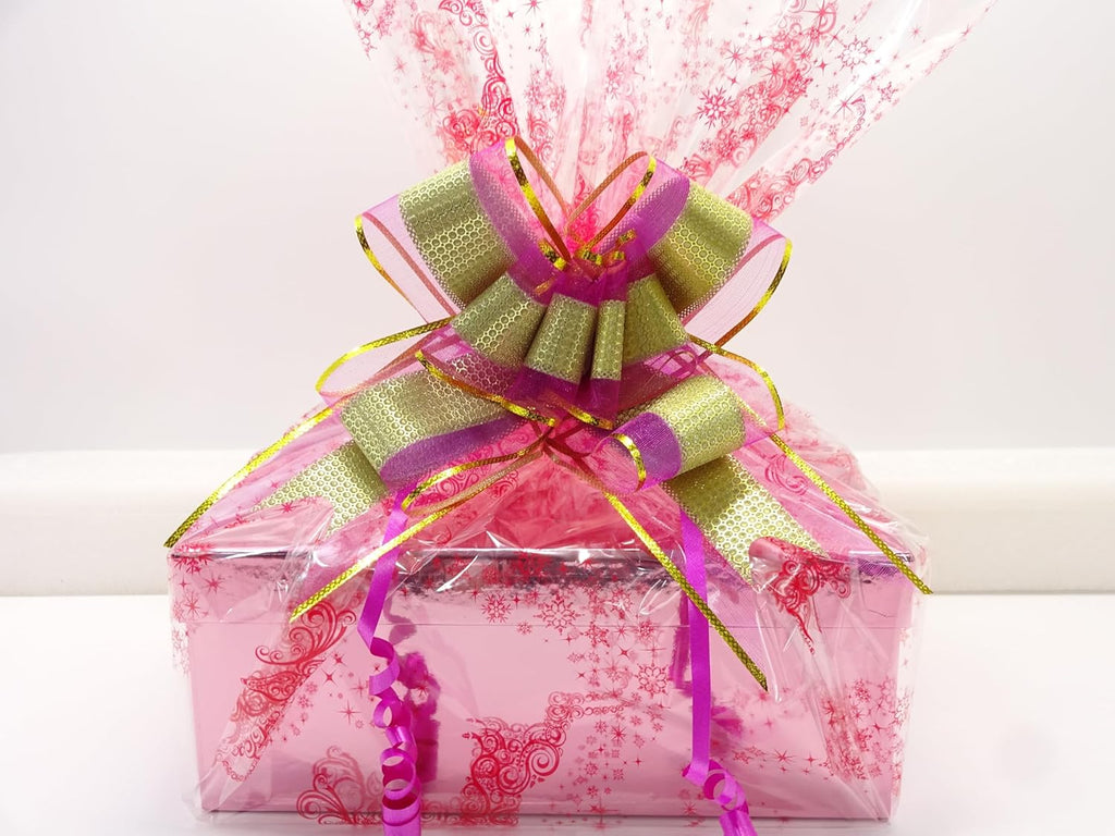 Detailed view of the gift bow on the Luxury Beauty Blockbuster Gift Box, featuring intricate pink and gold ribbon, ideal for any special occasion.