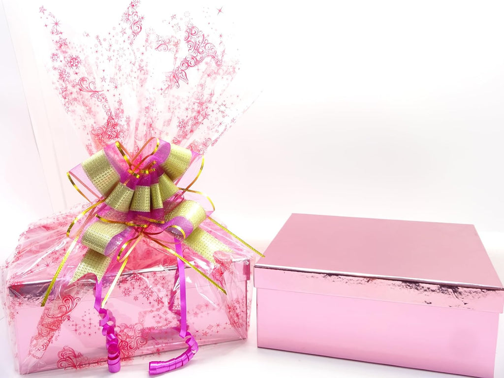 The open luxury pink gift box with tissue-wrapped beauty items inside, ready for a delightful unboxing experience.