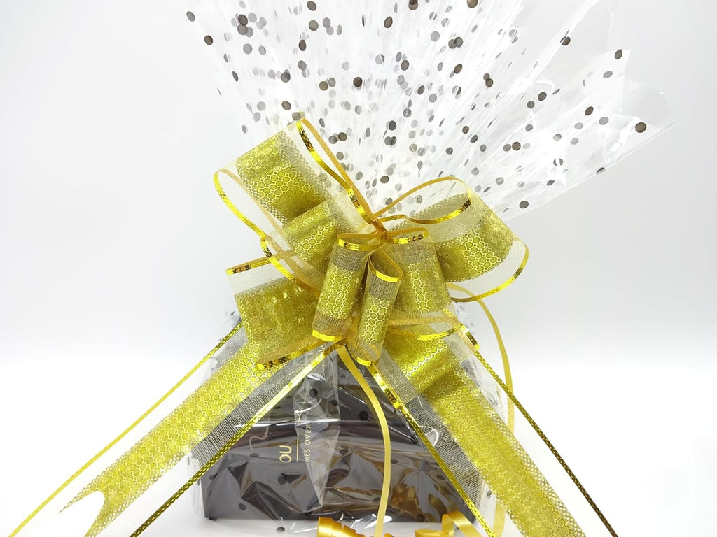 Close-up of the luxurious gold bow on the wrapped gift set, enhancing the elegant and festive appeal.