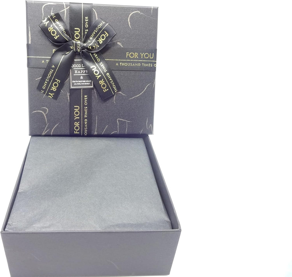 The luxury gift box open showing the neatly arranged items including the fragrance and grooming tools