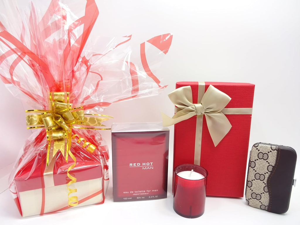 Complete boxed display of the Red Hot Man gift set, featuring a red gift box with a gold bow and matching manicure set.