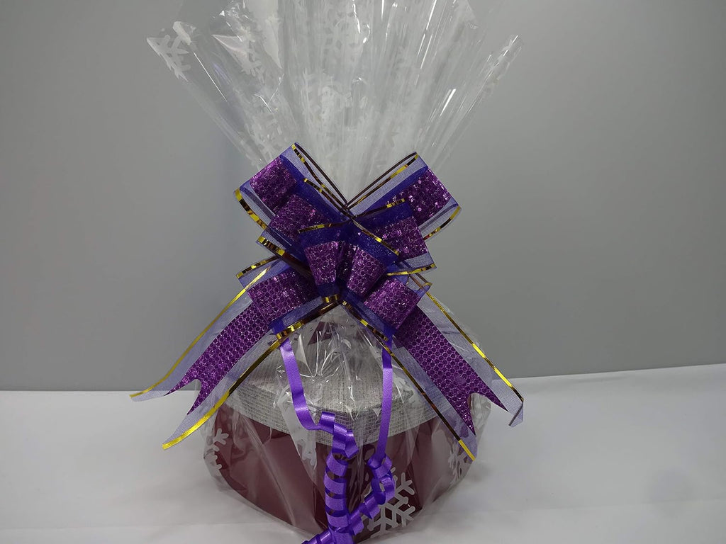 The heart-shaped gift box of MIX BRANDS 14pc Beauty Bundle, shown with a purple decorative ribbon and snowflake-patterned wrap.