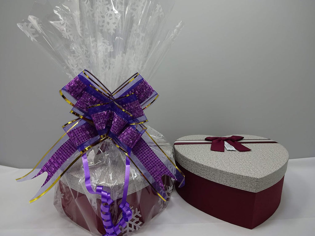 Wrapped version of MIX BRANDS 14pc Beauty Bundle, highlighting the heart-shaped gift box elegantly wrapped in clear cellophane with a purple ribbon.