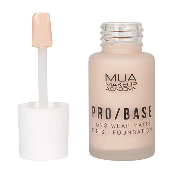 MUA Pro Base Long Wear Matte Finish Foundation in shade 120, bottle with open cap and spatula for precise application.