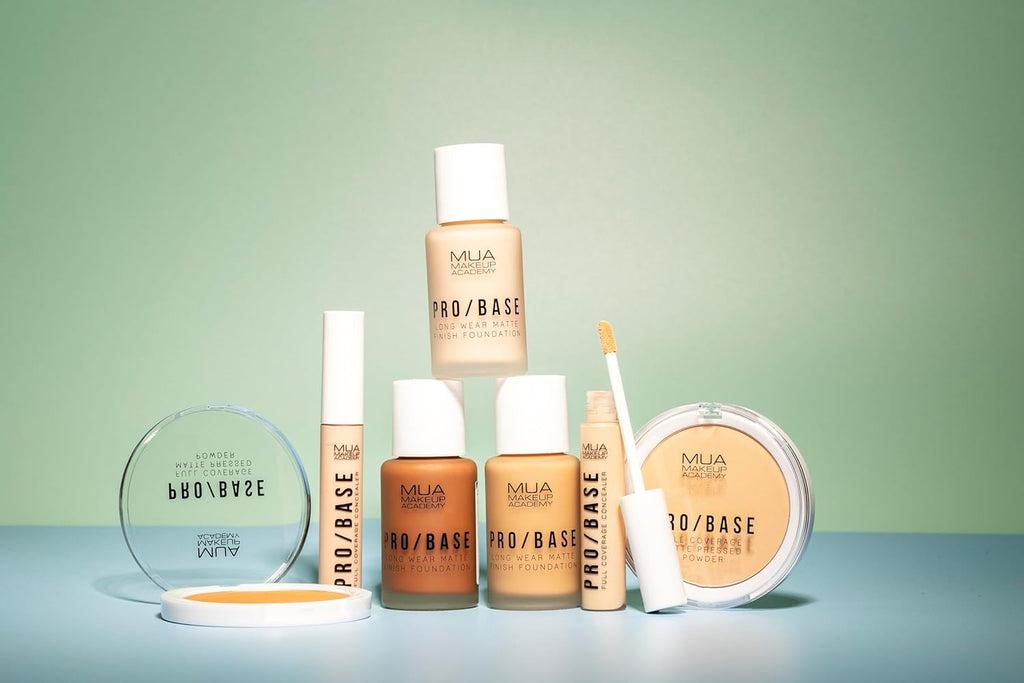 Collection of MUA Pro/Base Full Coverage Matte Foundations, powders, and concealers displayed