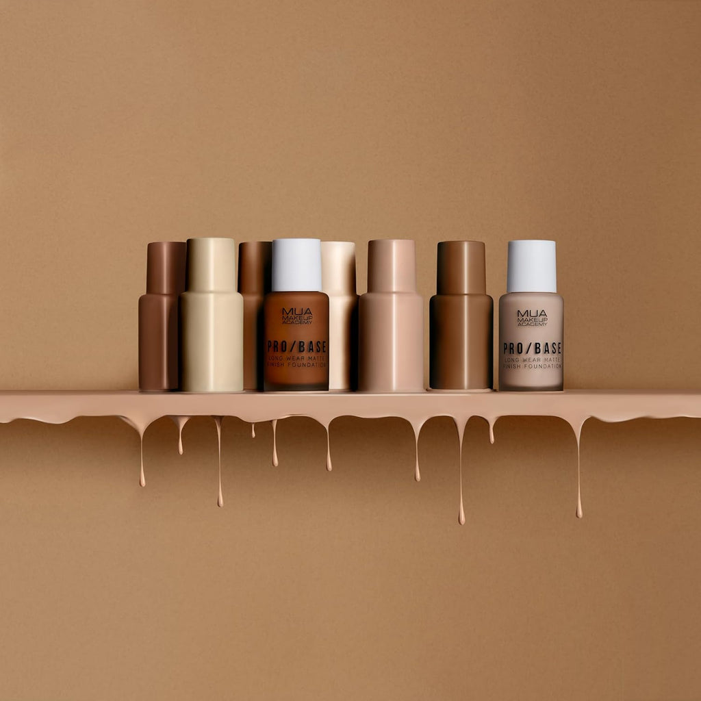 MUA Pro/Base Full Coverage Matte Foundation bottles in various shades including shade 190 with dripping foundation background