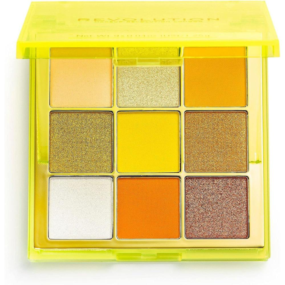 Open Makeup Revolution Neo Eyeshadow Palette showcasing 9 shades in yellow and orange tones.