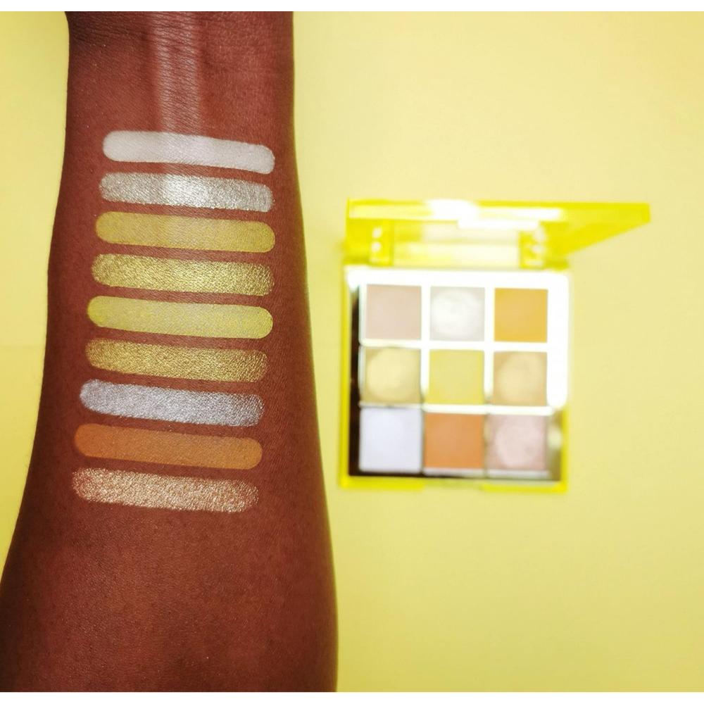 Makeup Revolution Neo Eyeshadow Palette swatches on dark skin, showing high-pigment yellow and gold shades.