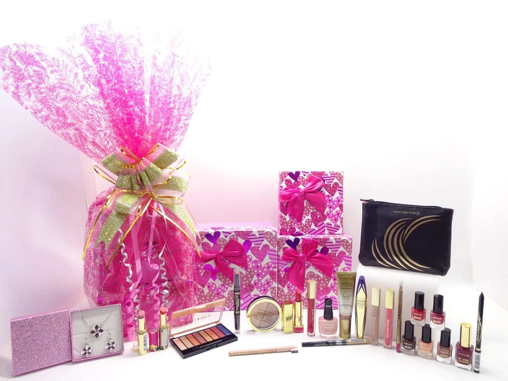 Max Factor 3-tier luxury makeup gift hamper with cosmetics, pink boxes, and bonus jewellery in display